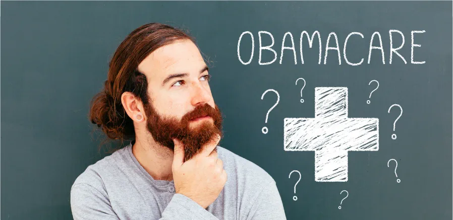 Hombre pensativo, mirando letrero de Obamacare